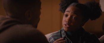 Movie still from “Something from Tiffany's” (2022), directed by Daryl Wein – A young woman talking to another woman in a room; Close Up shot, Over the shoulder angle