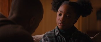 Movie still from “Something from Tiffany's” (2022), directed by Daryl Wein – A young girl sitting next to a younger boy on a couch; Close Up shot, Over the shoulder angle