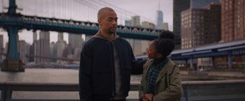 Movie still from “Something from Tiffany's” (2022), directed by Daryl Wein – A man standing next to a young girl in front of a bridge; Medium shot, Over the shoulder angle