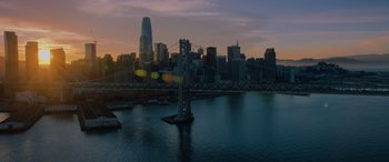 Movie still from “Sonic the Hedgehog” (2020), directed by Jeff Fowler – A view of a bridge and a city at sunset; Extreme Wide shot, High angle