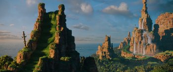 Movie still from “Sonic the Hedgehog” (2020), directed by Jeff Fowler – A view of a castle like castle on top of a hill; Extreme Wide shot, Low angle