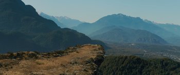 Movie still from “Sonic the Hedgehog” (2020), directed by Jeff Fowler – A view of a mountain range from a cliff; Extreme Wide shot, High angle