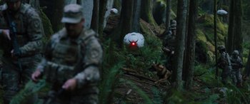 Movie still from “Sonic the Hedgehog” (2020), directed by Jeff Fowler – A group of people in the woods with a dog; Extreme Wide shot, Over the shoulder angle