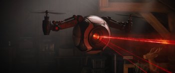 Movie still from “Sonic the Hedgehog” (2020), directed by Jeff Fowler – An image of a robot with a red light coming out of it; Wide shot, Overhead angle