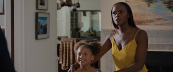 Movie still from “Sonic the Hedgehog” (2020), directed by Jeff Fowler – A young girl getting her hair done by a woman; Close Up shot, Over the shoulder angle