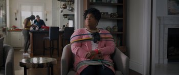 Movie still from “Sonic the Hedgehog” (2020), directed by Jeff Fowler – A woman sitting in a chair with her hands tied up; Medium shot, Over the shoulder angle