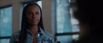 Movie still from “Sonic the Hedgehog” (2020), directed by Jeff Fowler – A woman in a jean jacket looking at the camera; Close Up shot, Over the shoulder angle