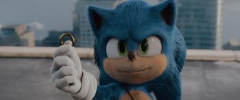 Movie still from “Sonic the Hedgehog” (2020), directed by Jeff Fowler – A sonic the hedgehog holding a game controller; Close Up shot, Over the shoulder angle