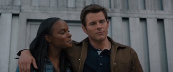 Movie still from “Sonic the Hedgehog” (2020), directed by Jeff Fowler – A man and a woman standing next to each other; Close Up shot, Over the shoulder angle