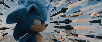 Movie still from “Sonic the Hedgehog” (2020), directed by Jeff Fowler – A bunch of missiles flying in the air with a sonic the hedgehog in the background; Medium shot, Over the shoulder angle