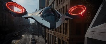 Movie still from “Sonic the Hedgehog” (2020), directed by Jeff Fowler – A man riding in the back of a flying car; Wide shot, High angle