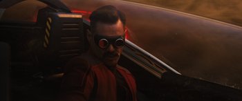 Movie still from “Sonic the Hedgehog” (2020), directed by Jeff Fowler – A man wearing goggles and a red jacket; Close Up shot, Over the shoulder angle