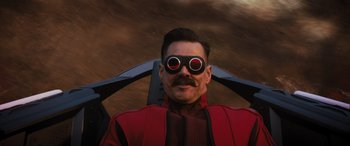 Movie still from “Sonic the Hedgehog” (2020), directed by Jeff Fowler – A man wearing goggles and a red jacket; Close Up shot, Over the shoulder angle