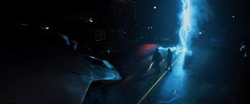 Movie still from “Sonic the Hedgehog” (2020), directed by Jeff Fowler – Two people are walking down the street at night; Extreme Wide shot, High angle