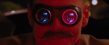 Movie still from “Sonic the Hedgehog” (2020), directed by Jeff Fowler – A person wearing a pair of goggles; Extreme Close Up shot, Overhead angle
