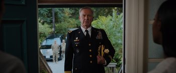 Movie still from “Sonic the Hedgehog” (2020), directed by Jeff Fowler – A man in a military uniform holding a sword; Medium shot, Over the shoulder angle