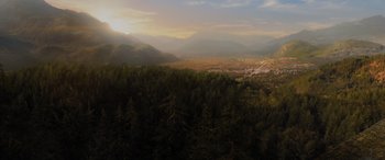 Movie still from “Sonic the Hedgehog” (2020), directed by Jeff Fowler – A view of a valley and a city from above; Extreme Wide shot, High angle