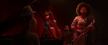 Movie still from “Soul” (2020), directed by Kemp Powers – A group of people playing musical instruments in a room; Wide shot, Over the shoulder angle