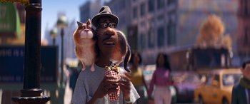 Movie still from “Soul” (2020), directed by Kemp Powers – A man holding a cat on his shoulder; Close Up shot, Over the shoulder angle