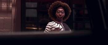 Movie still from “Soul” (2020), directed by Kemp Powers – A woman with a big curly afro is looking at the camera; Close Up shot, Over the shoulder angle