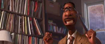 Movie still from “Soul” (2020), directed by Kemp Powers – An animated man in a suit and tie with glasses; Close Up shot, Low angle
