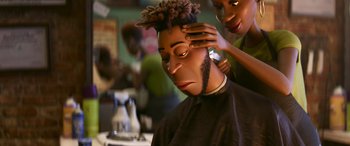 Movie still from “Soul” (2020), directed by Kemp Powers – A man getting his hair cut at a barber shop; Close Up shot, Over the shoulder angle