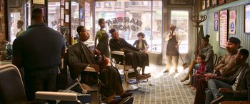 Movie still from “Soul” (2020), directed by Kemp Powers – A group of people sitting in a barber shop; Wide shot, Over the shoulder angle