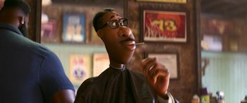 Movie still from “Soul” (2020), directed by Kemp Powers – A man with glasses is holding a cigarette in his mouth; Close Up shot, Over the shoulder angle