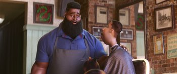 Movie still from “Soul” (2020), directed by Kemp Powers – A man with a large beard talking to another man in a barber shop; Medium shot, Over the shoulder angle