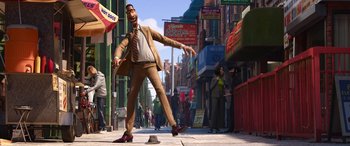 Movie still from “Soul” (2020), directed by Kemp Powers – An animated man in a brown suit and a hat; Wide shot, Low angle
