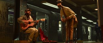 Movie still from “Soul” (2020), directed by Kemp Powers – Two men are playing music on a subway platform; Wide shot, Low angle