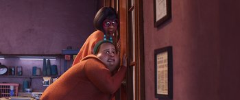 Movie still from “Soul” (2020), directed by Kemp Powers – A couple of people standing next to each other in front of a door; Medium shot, High angle