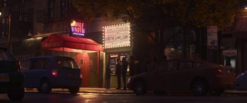 Movie still from “Soul” (2020), directed by Kemp Powers – People standing outside of a theater at night; Extreme Wide shot, High angle