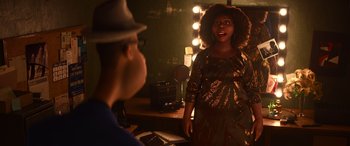 Movie still from “Soul” (2020), directed by Kemp Powers – A man and a woman in front of a lighted mirror; Medium shot, Over the shoulder angle