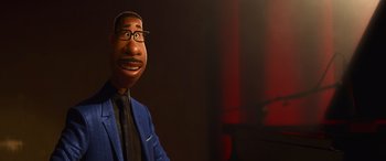 Movie still from “Soul” (2020), directed by Kemp Powers – A man in a blue jacket and a black tie; Close Up shot, Low angle