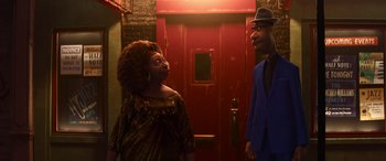 Movie still from “Soul” (2020), directed by Kemp Powers – A man and a woman standing next to each other in front of a red door; Medium shot, Over the shoulder angle