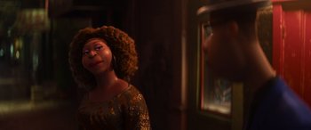 Movie still from “Soul” (2020), directed by Kemp Powers – A woman standing in front of a mirror in a room; Medium shot, Over the shoulder angle