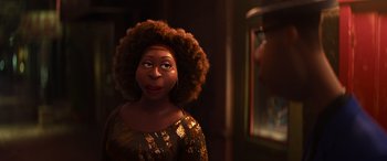 Movie still from “Soul” (2020), directed by Kemp Powers – A woman with a large afro is looking at a mirror; Close Up shot, Over the shoulder angle
