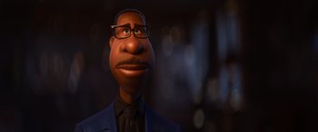 Movie still from “Soul” (2020), directed by Kemp Powers – An animated man wearing glasses and a suit; Close Up shot, Low angle