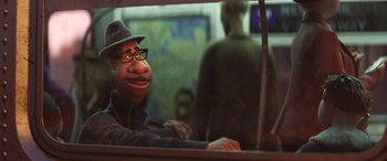 Movie still from “Soul” (2020), directed by Kemp Powers – A man in a hat and glasses looking out of a window; Close Up shot, Over the shoulder angle