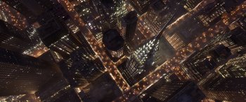Movie still from “Soul” (2020), directed by Kemp Powers – An aerial view of a city at night with buildings lit up at night; Extreme Wide shot, Overhead angle
