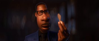 Movie still from “Soul” (2020), directed by Kemp Powers – An animated man in a suit holding a wooden spoon; Close Up shot, High angle
