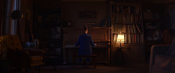 Movie still from “Soul” (2020), directed by Kemp Powers – A man sitting at a piano in a dark room; Extreme Wide shot, High angle