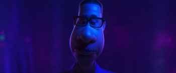 Movie still from “Soul” (2020), directed by Kemp Powers – A man with a mustache wearing glasses and a beard; Close Up shot, Low angle