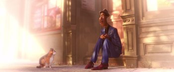 Movie still from “Soul” (2020), directed by Kemp Powers – An animated man sitting next to a white cat; Wide shot, Low angle