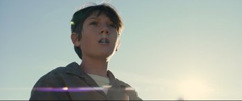 Movie still from “Brightburn” (2019), directed by David Yarovesky – A young boy is looking up at the sky; Close Up shot, Low angle