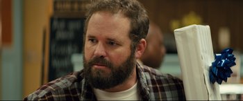 Movie still from “Brightburn” (2019), directed by David Yarovesky – A man with a goatee and a plaid shirt; Close Up shot, Over the shoulder angle