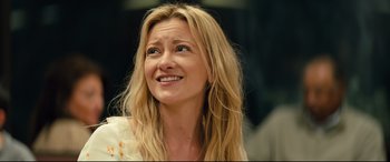 Movie still from “Brightburn” (2019), directed by David Yarovesky – A beautiful blond haired woman smiling for the camera; Close Up shot, Low angle