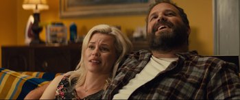 Movie still from “Brightburn” (2019), directed by David Yarovesky – A man and a woman sitting next to each other in a room; Medium shot, Over the shoulder angle