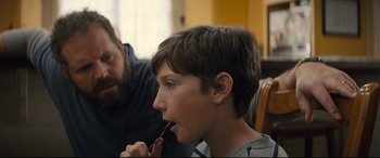 Movie still from “Brightburn” (2019), directed by David Yarovesky – A young boy brushing his teeth with a toothbrush; Close Up shot, Over the shoulder angle